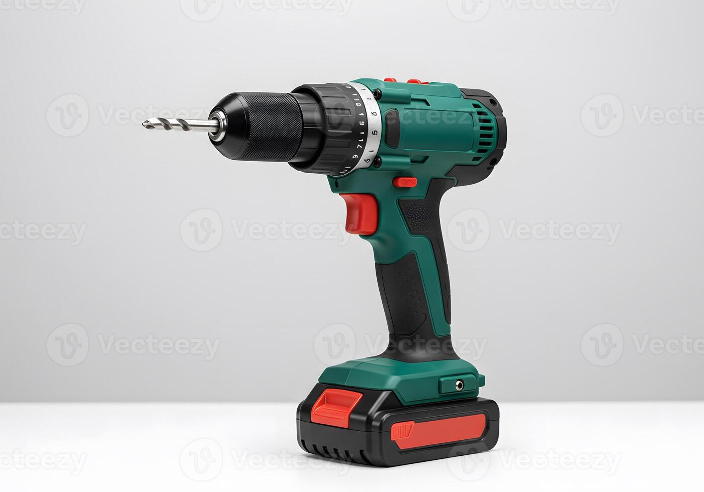 Green Cordless Drill with Red Accents on White Background photo