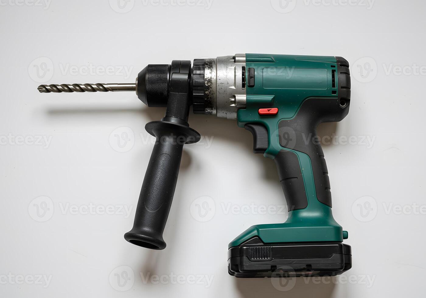 Green Cordless Drill with Black Handle and Bit on White Background photo
