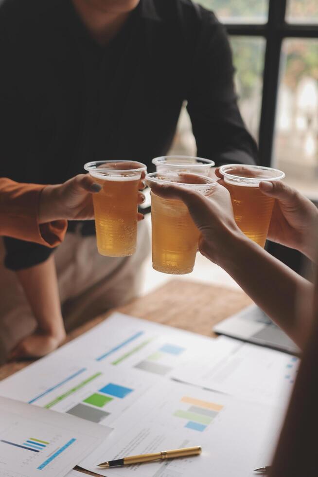 Business people toasting beer at a meeting photo