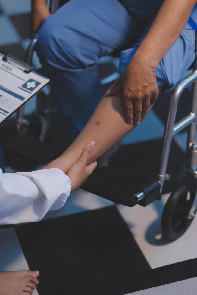 A doctor is examining a patient's leg photo