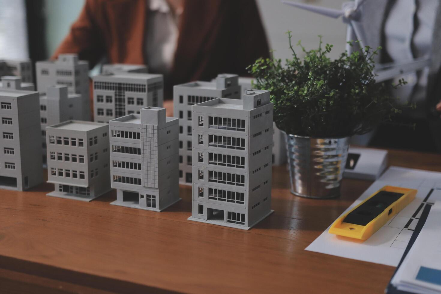 A group of people working on a building model photo