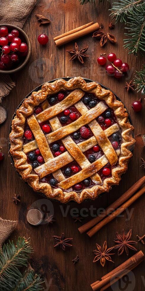Delicious homemade berry pie with a golden lattice crust, surrounded by fresh cranberries, cinnamon sticks, and star anise on a rustic wooden table. photo
