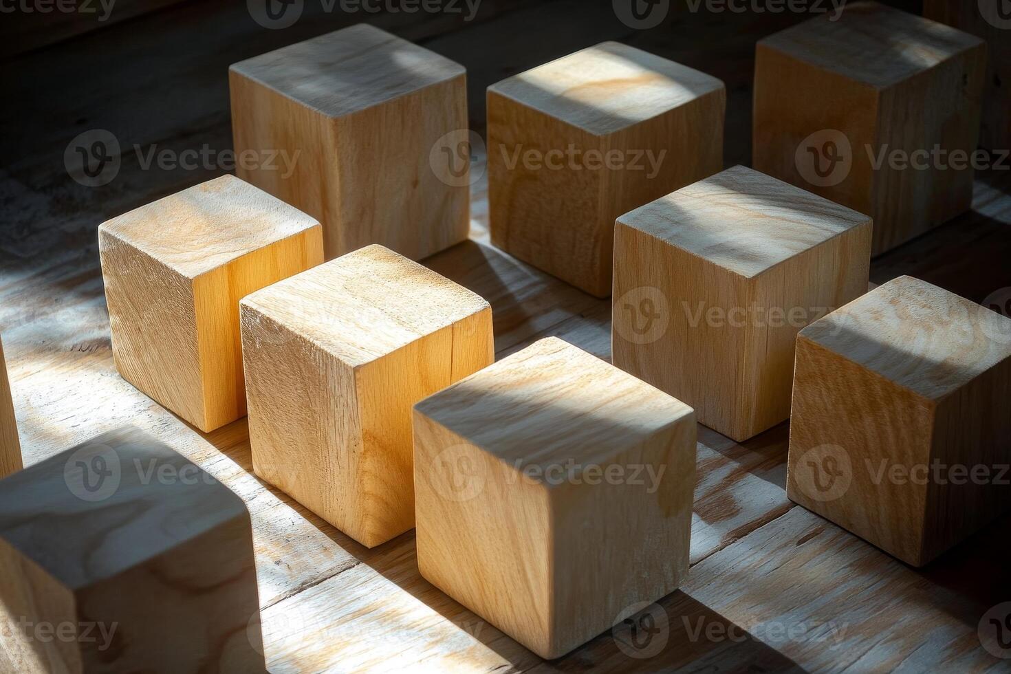 A collection of natural wooden cubes arranged artistically on a rustic surface, illuminated by soft light, creating a warm and inviting atmosphere. photo