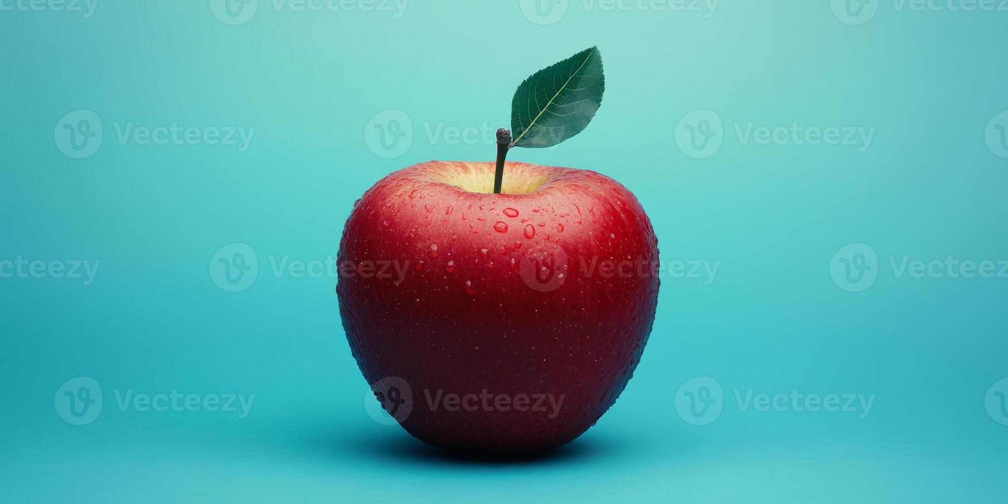 A red apple with a green leaf on top. The apple is wet and shiny. Concept of freshness and natural beauty photo