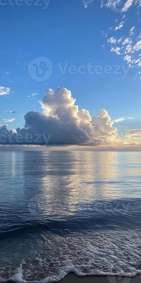 Captivating ocean scene with dramatic clouds and serene reflections at sunset, showcasing nature's beauty. photo