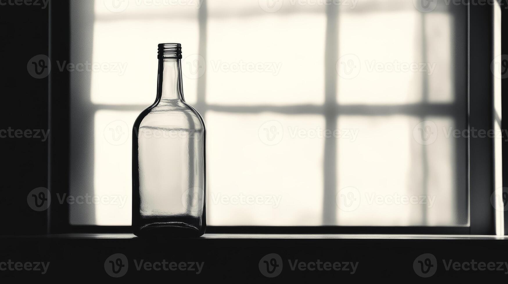 A bottle of alcohol is sitting on a window sill. The bottle is empty. The window is open photo