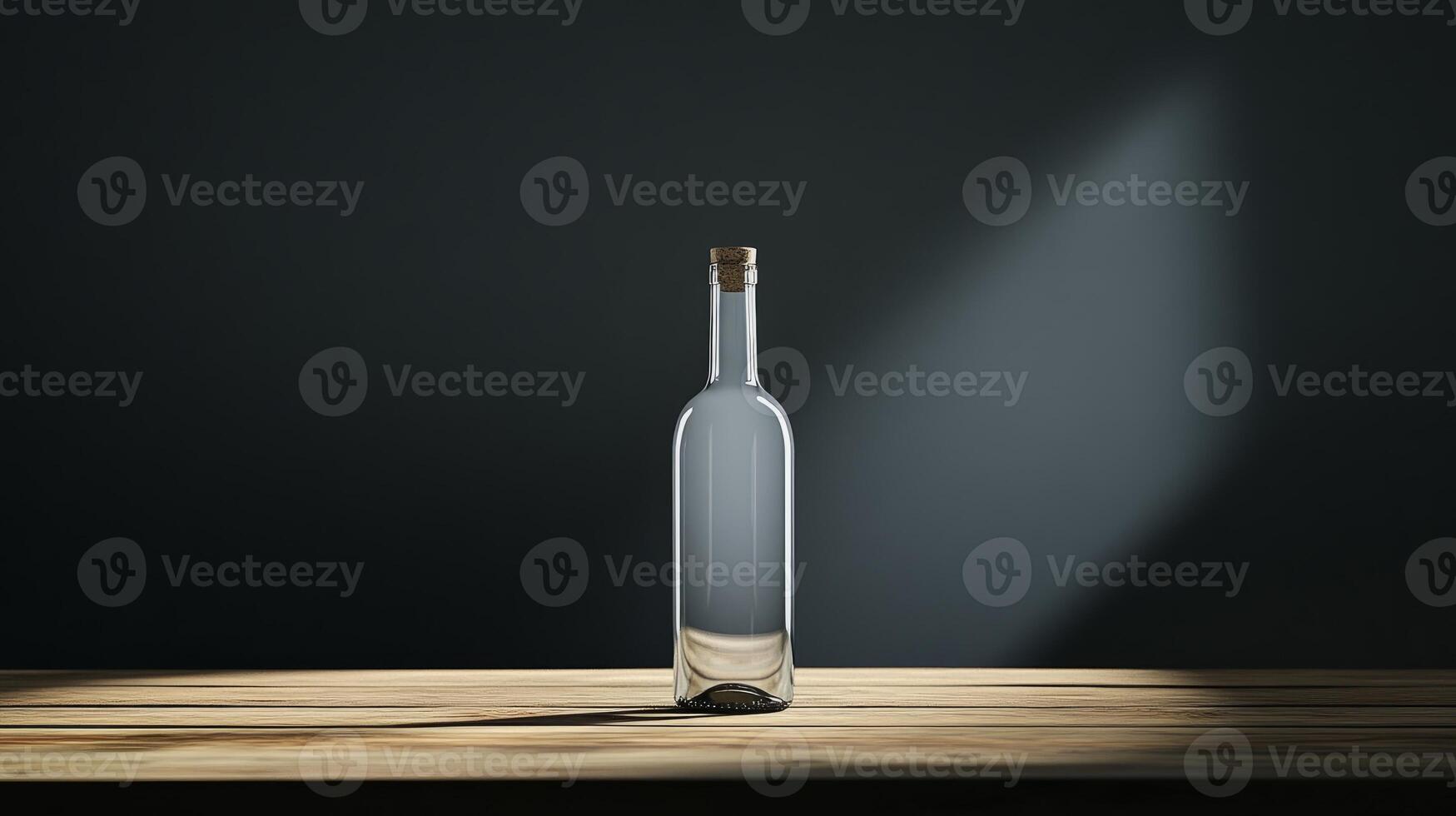 A clear glass bottle stands on a wooden table, illuminated by a beam of light against a dark backdrop, creating a minimalist and dramatic scene. photo