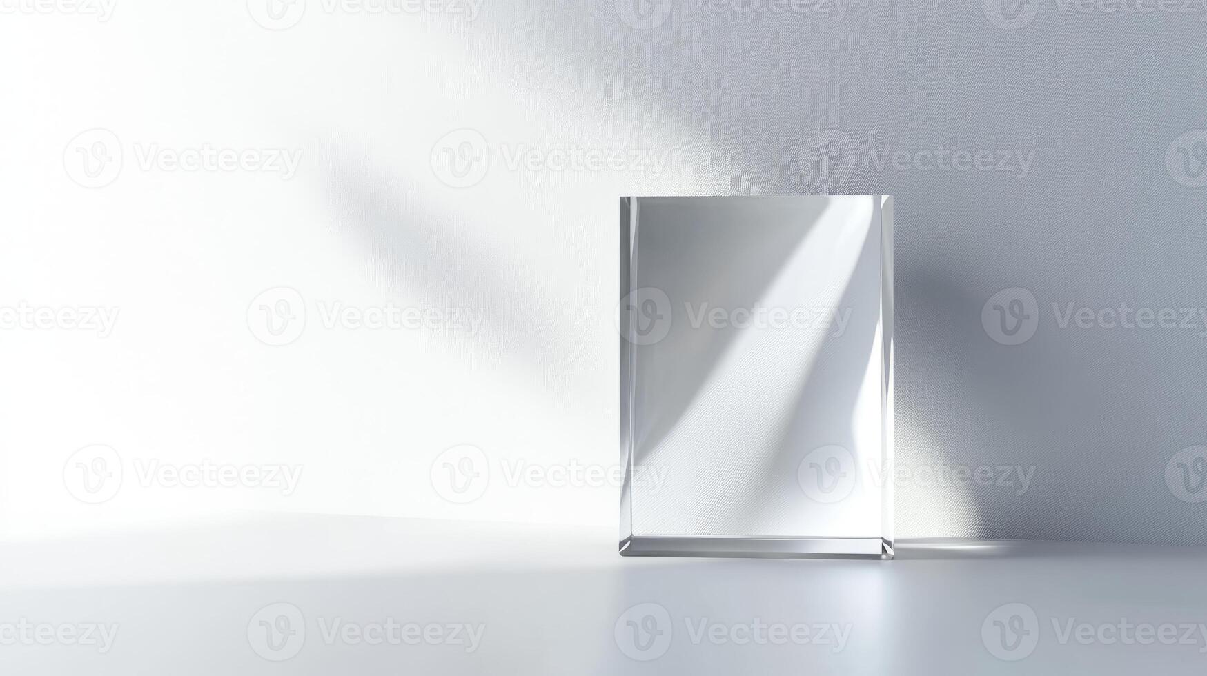 A clear glass box is sitting on a white table. The box is empty photo