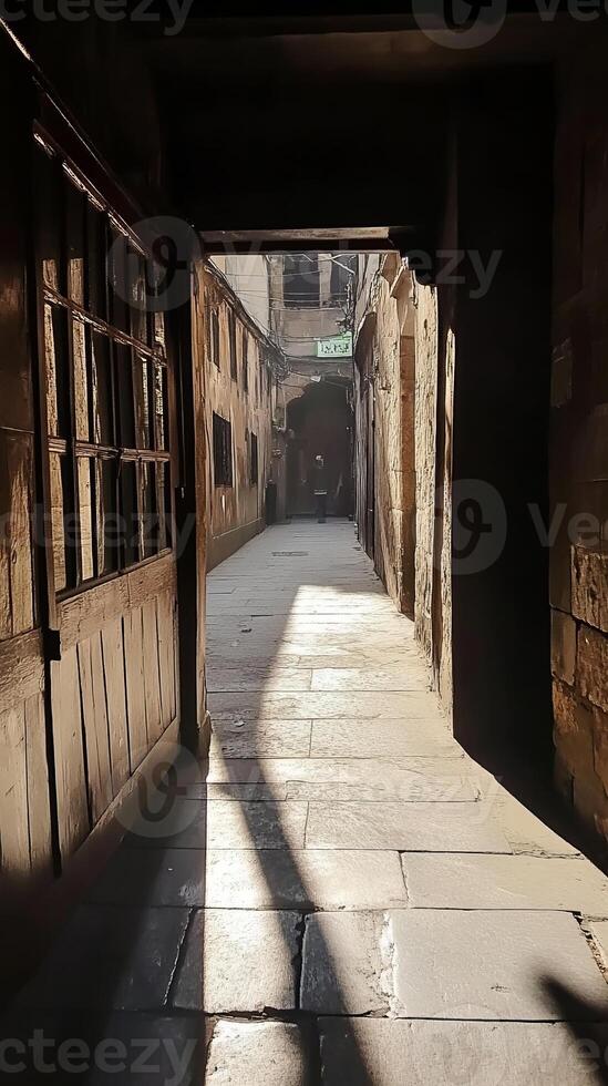Sunlit narrow alleyway with stone path and historic architecture, capturing the essence of an ancient urban environment. photo