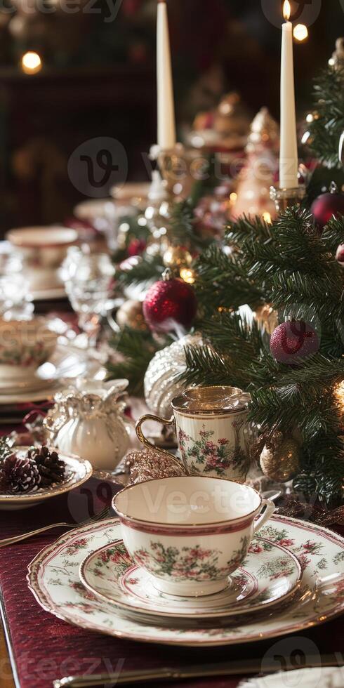 A beautifully decorated Christmas table with fine china, festive ornaments, and candles, creating a warm holiday atmosphere. photo