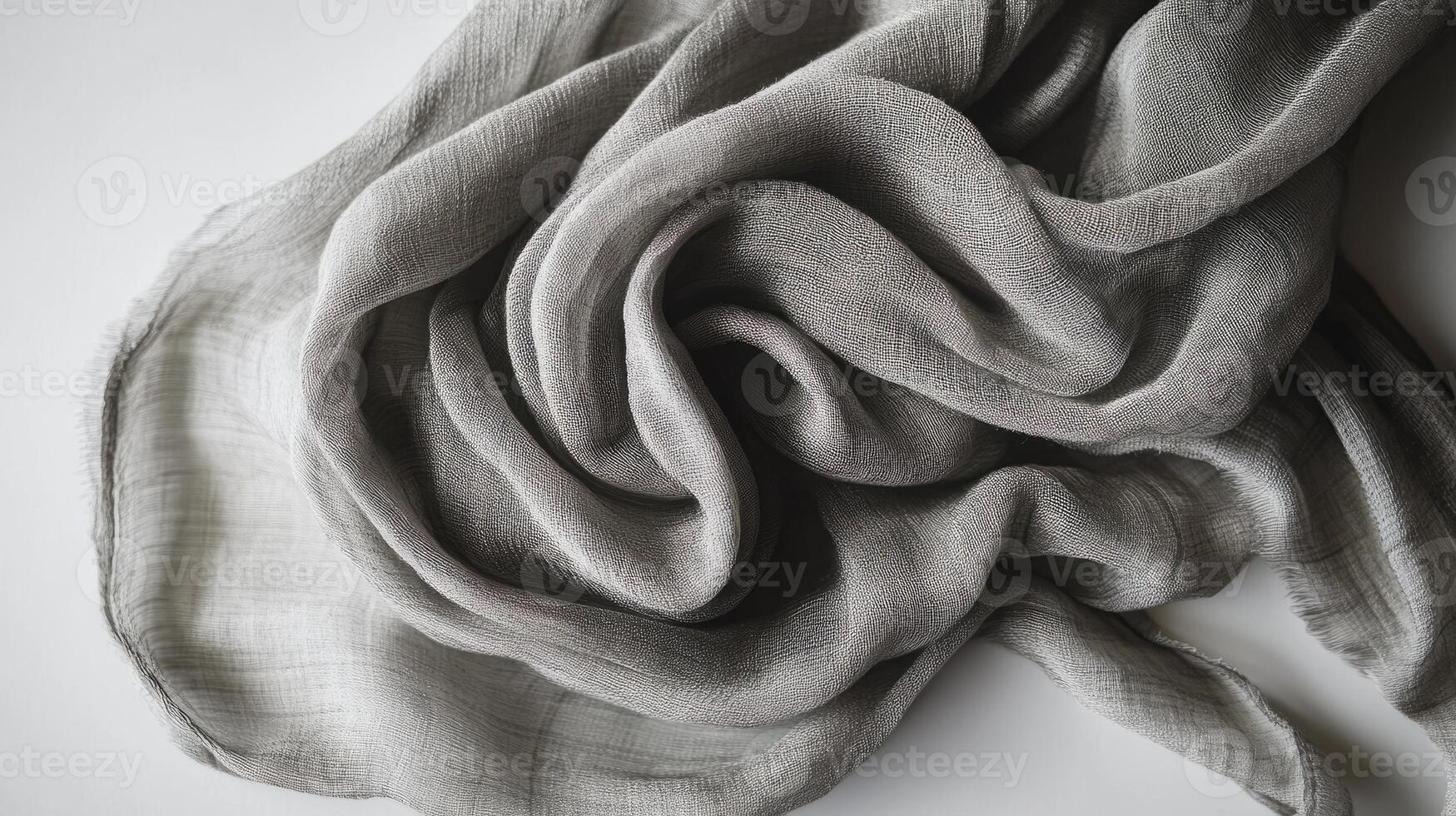 A piece of fabric with a pattern on it. The fabric is grey and has a lot of texture photo