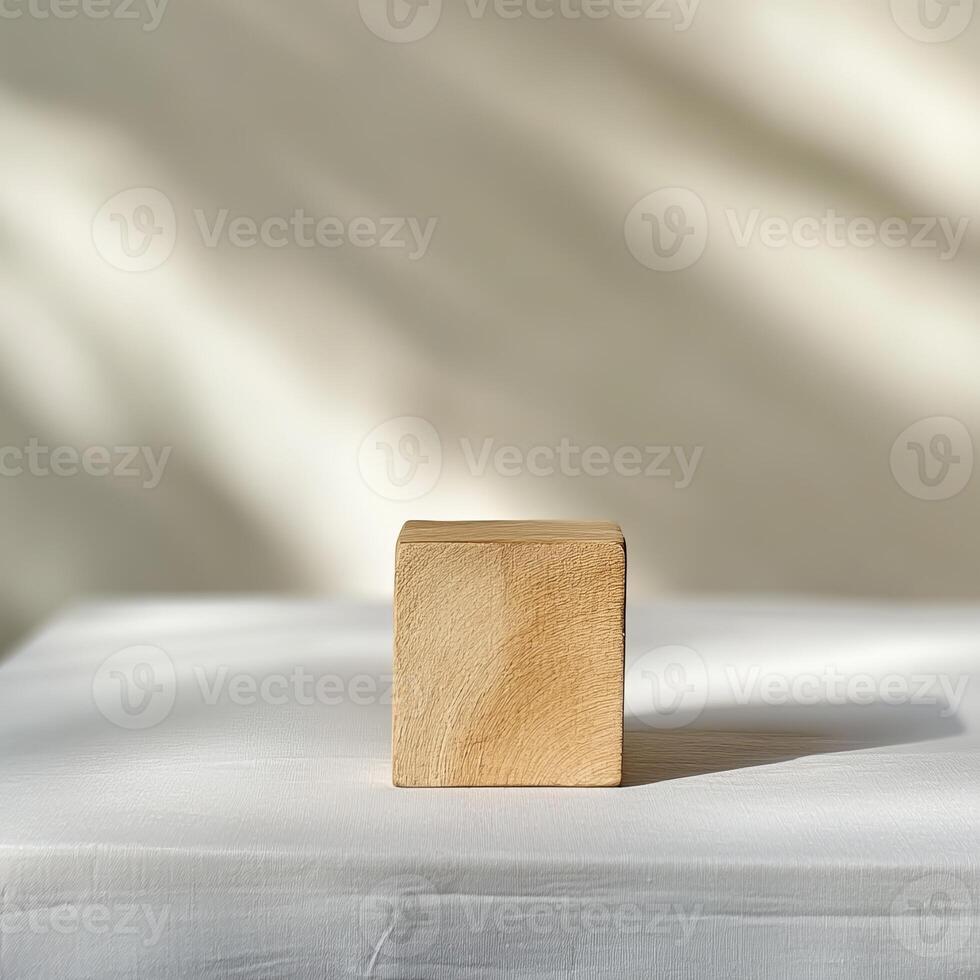 Minimalist Wooden Cube on White Surface with Soft Shadows and Neutral Background photo