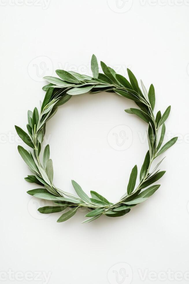 Wreath made of green leaves is placed on a white background photo