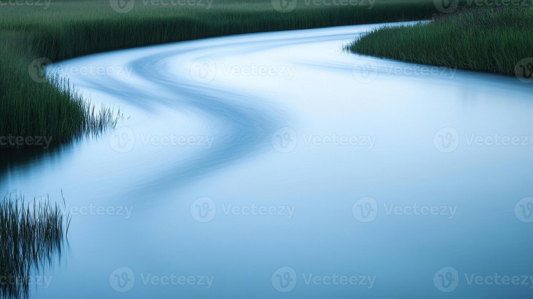 Serene River Flowing Through Meadow photo