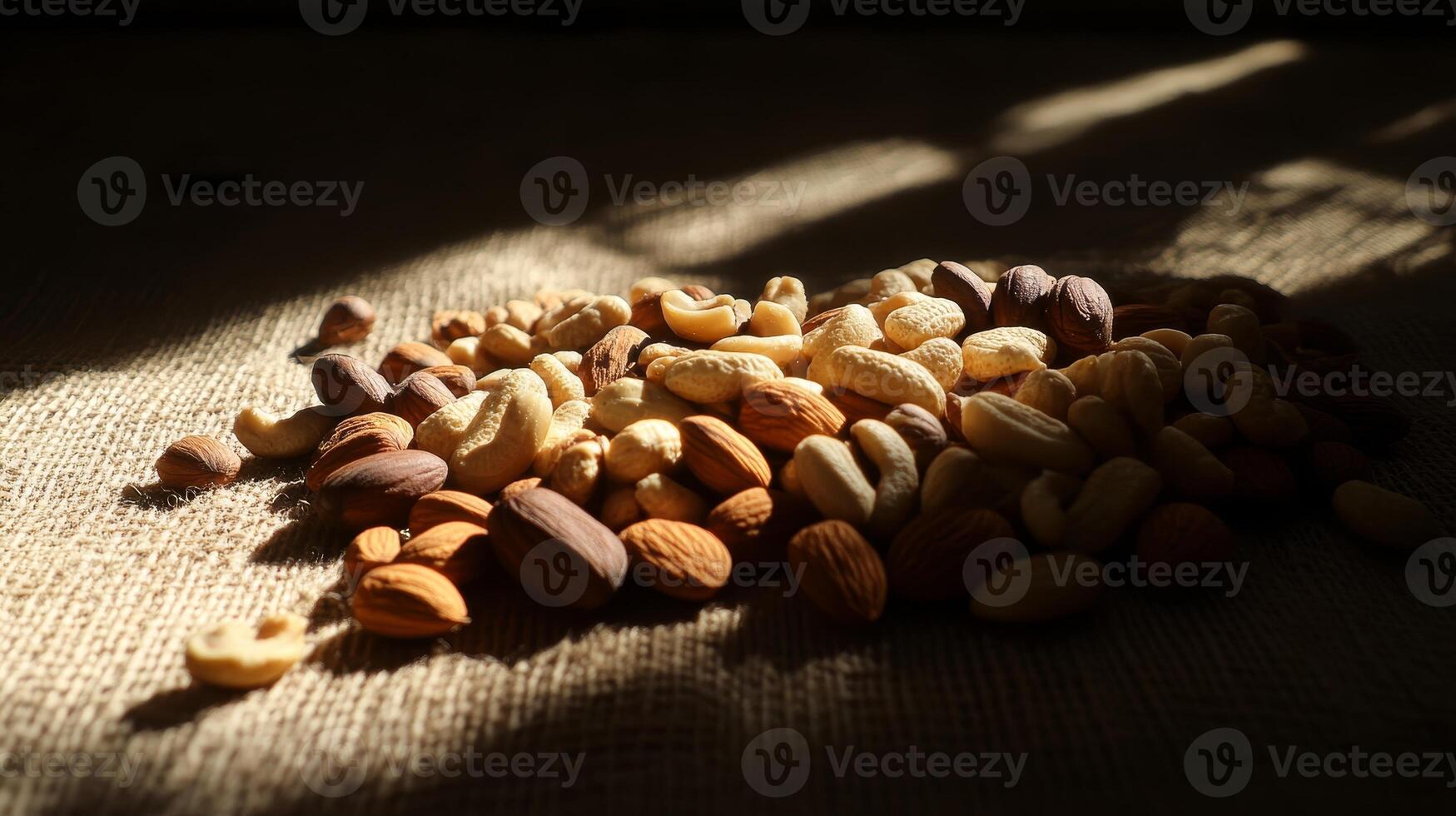 Assorted Raw Nuts on Natural Fiber Background with Soft Light Effects photo