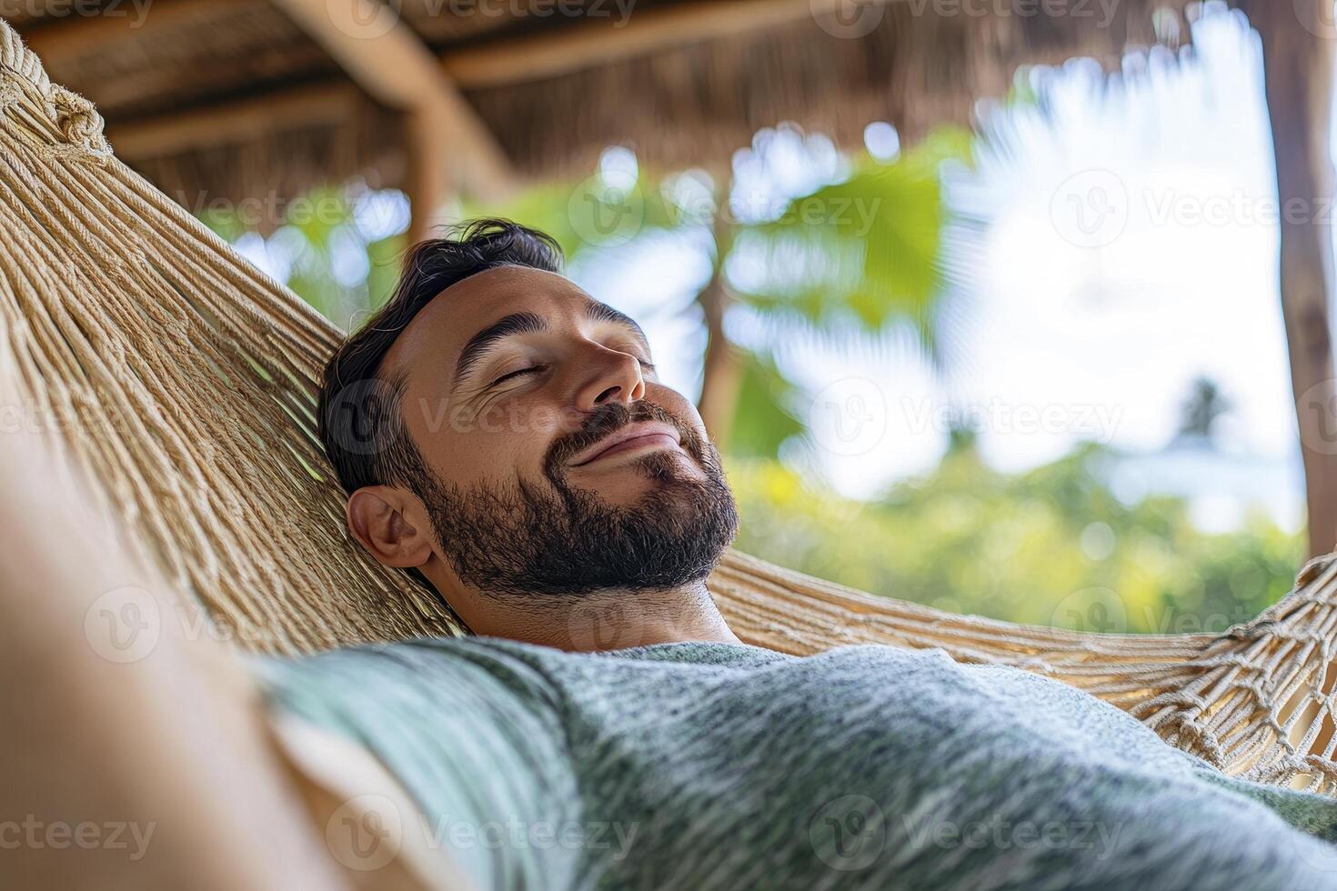 Relaxed Man in Hammock, Tropical Setting photo