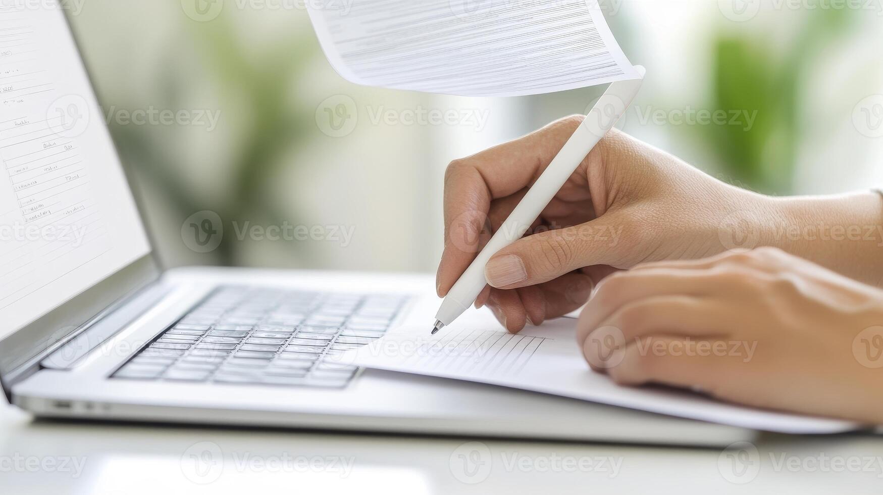 Elevate your content creation with a captivating image of hands poised to write on paper alongside a sleek laptop, symbolizing innovation and productivity Explore the dynamic intersection of photo