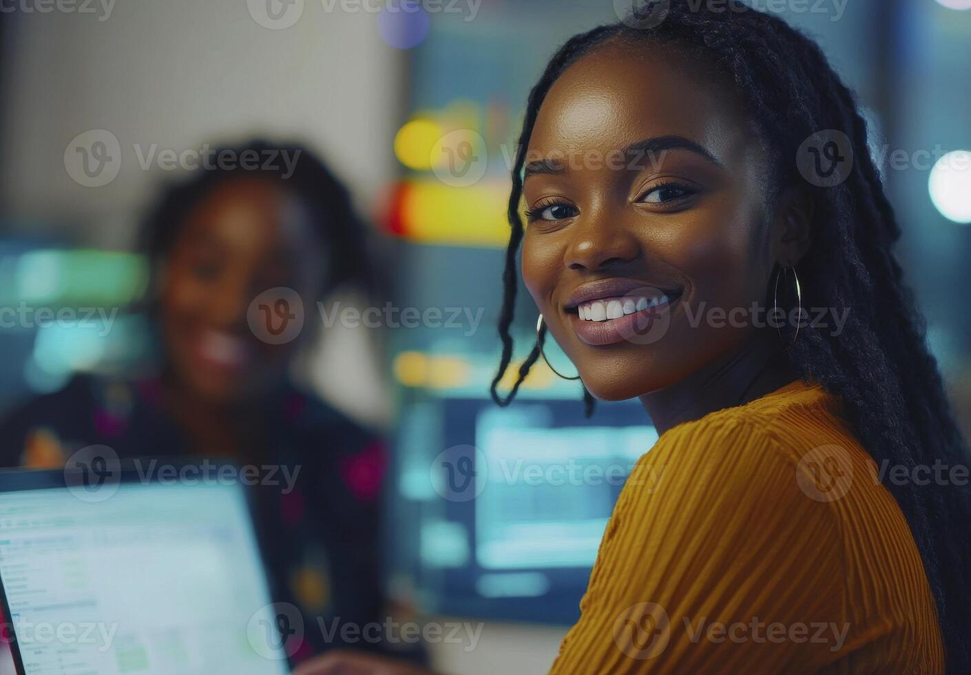 Empowering Innovation A Vibrant Image Showcasing a Confident Black Woman with Radiant Skin, Smiling Genuinely in a Modern Office Setting, Collaborating with Colleagues on Technological Advancements photo