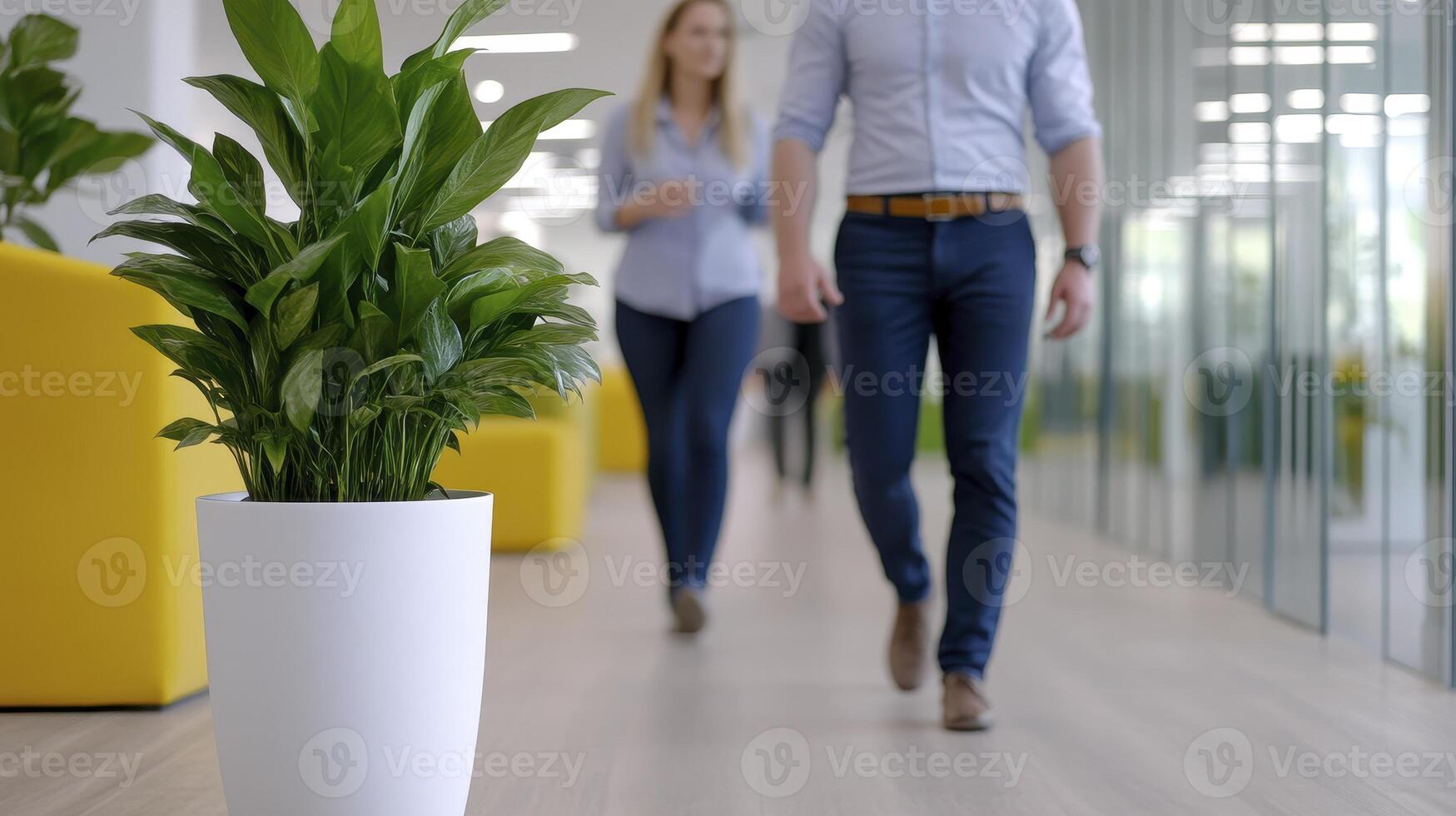 Office Setting People walking through modern office space with plants, sunlight, and open areas, showcasing professional environment, work-life balance, and collaborative teamwork, for websites photo