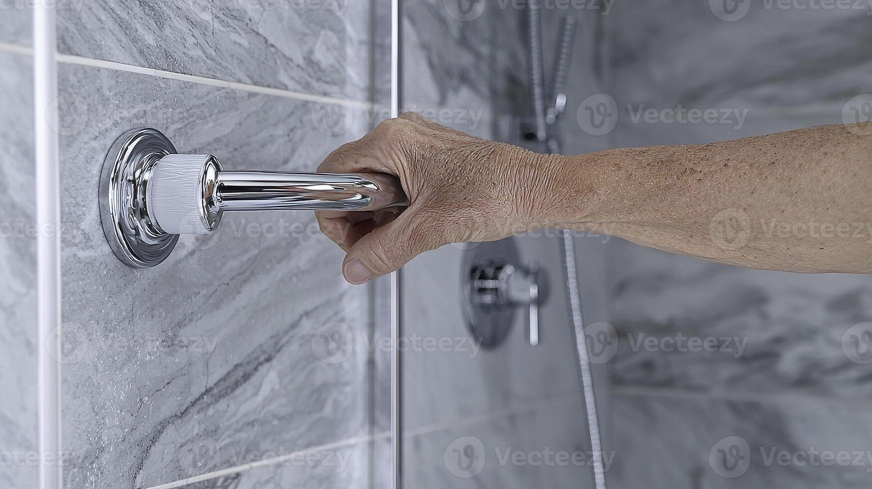 Explore this meticulously detailed close-up image showcasing the installation of a grab bar in a modern bathroom, emphasizing safety and accessibility features for enhanced mobility and support photo