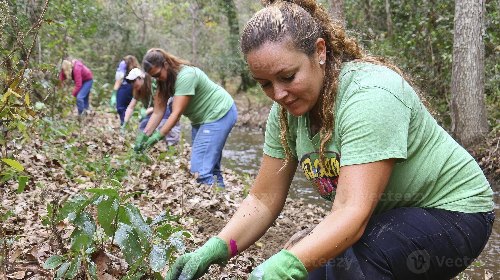Volunteers working together to clean up a natural area, showcasing community involvement and environmental stewardship, emphasizing collaboration, outdoor activity, and conservation efforts The image photo