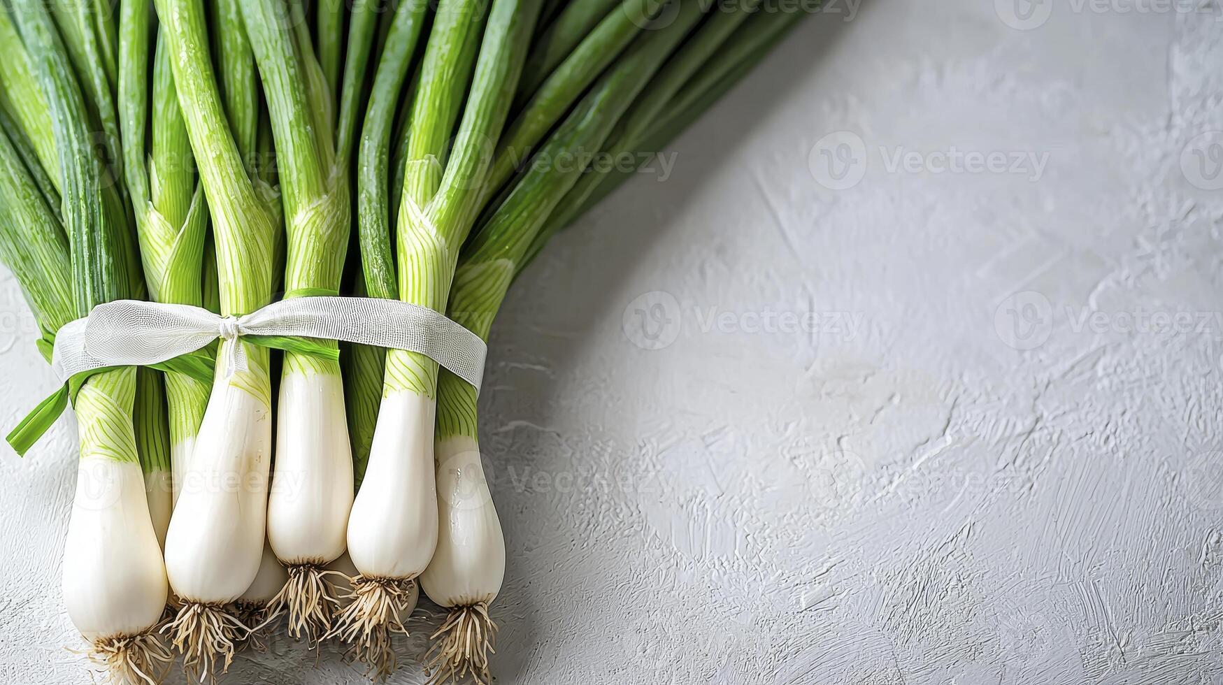 Fresh Green Onions on White Background A Culinary Delight Captured in High Resolution Discover the Vibrant Colors and Textures of These Spring Onions, Perfect for Enhancing Your Recipes and Visual photo