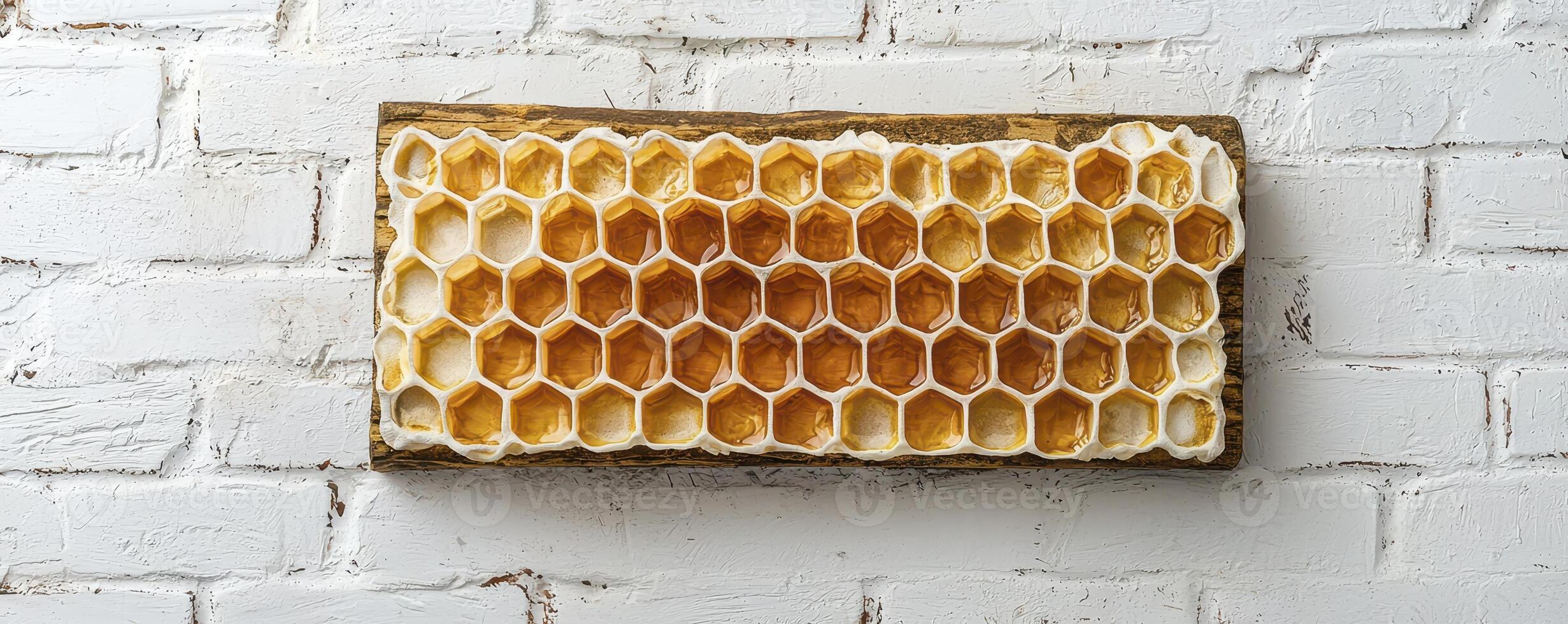 Captivating Honeycomb Display A Close-Up of Nature's Sweet Geometry on a Rustic White Brick Wall Explore the intricate details of this organic hexagonal pattern, showcasing the beauty of natural photo