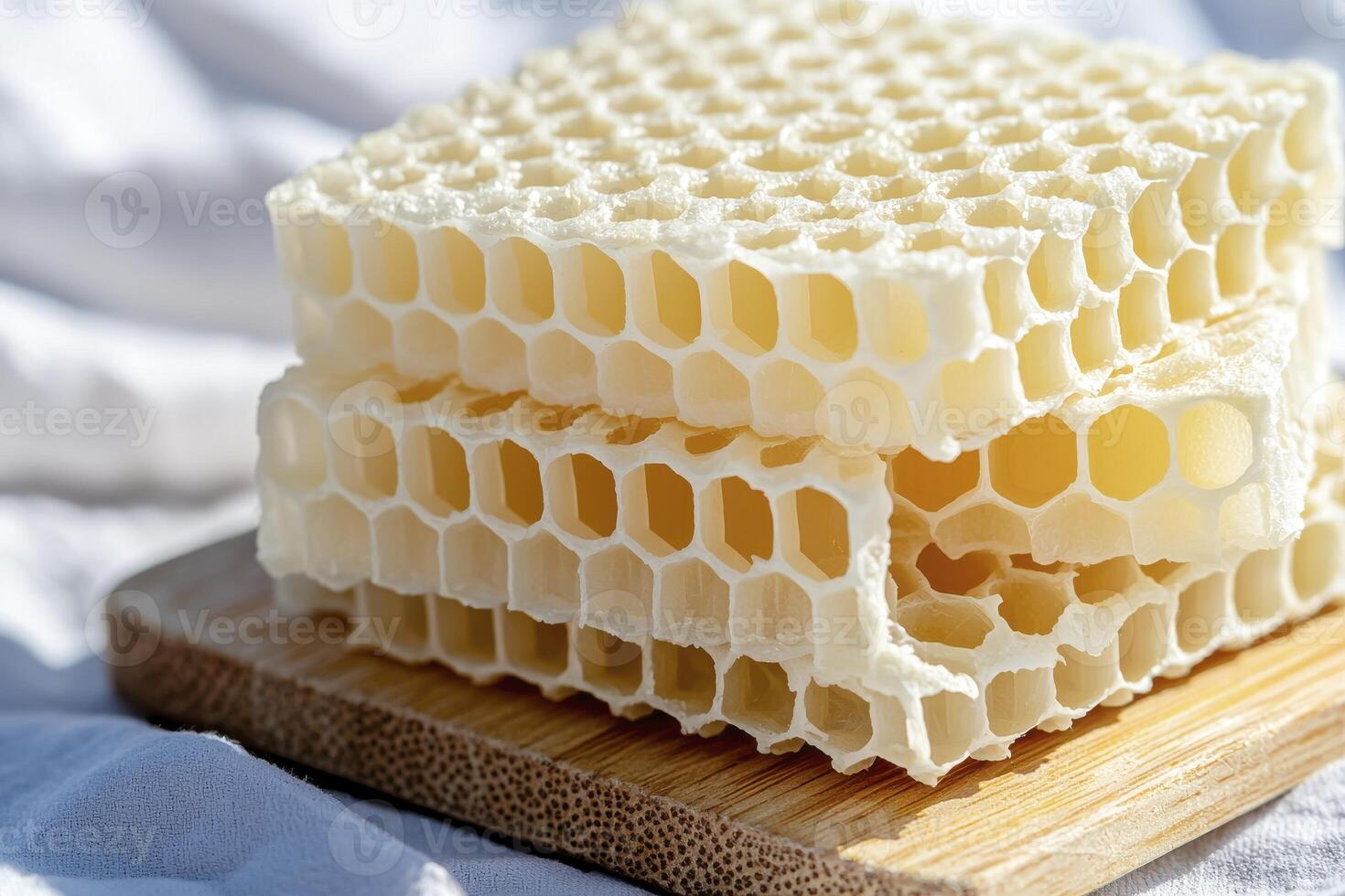 Captivating Honeycomb Stack A Close-Up Image Showcasing the Intricate Beauty of Nature's Design Explore the geometric precision and delicious sweetness embodied within these hexagonal cells photo
