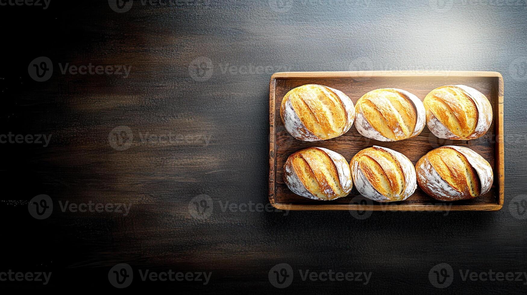 A generous tray of freshly baked bread loaves ready to be served as a delicious addition to any meal or gathering photo