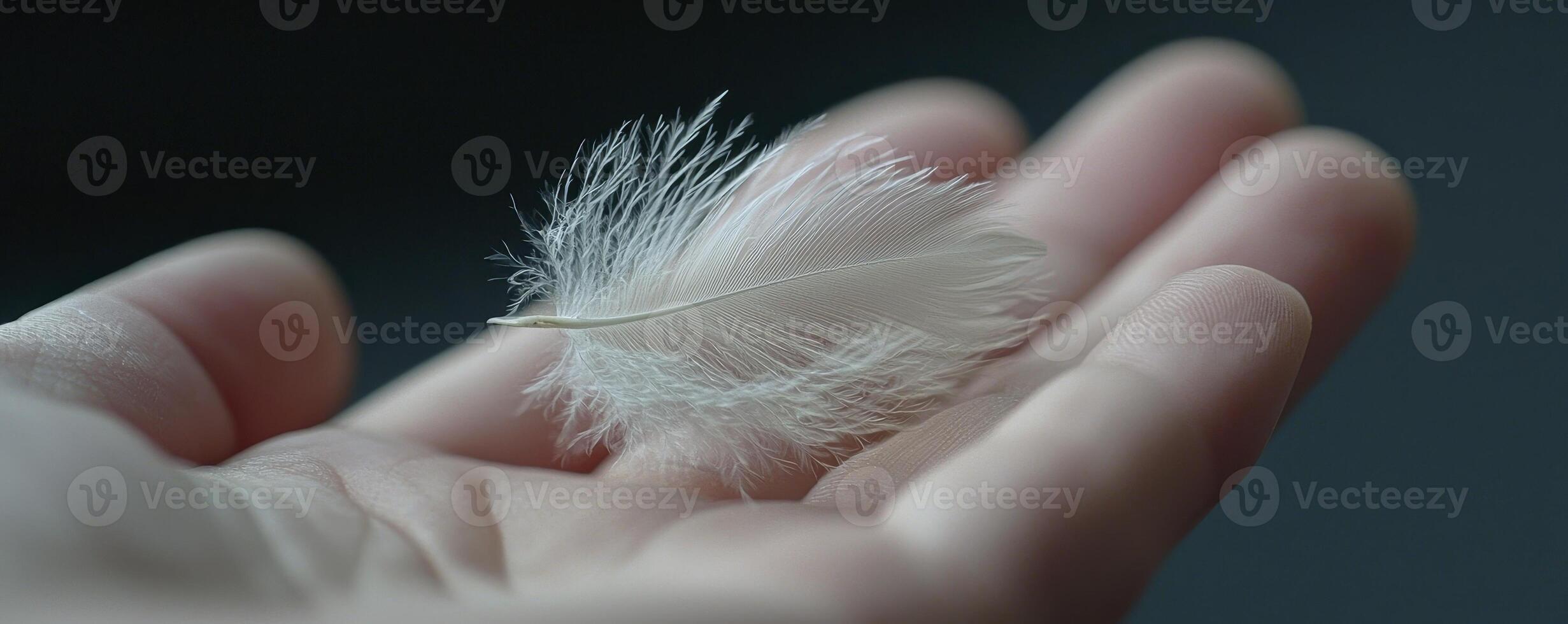 A delicate dance of breath and feather, the essence of lightness captured in a single moment Palm cradling fragility, a puff of air ignites a subtle ballet Softness personified, a whisper of movement photo