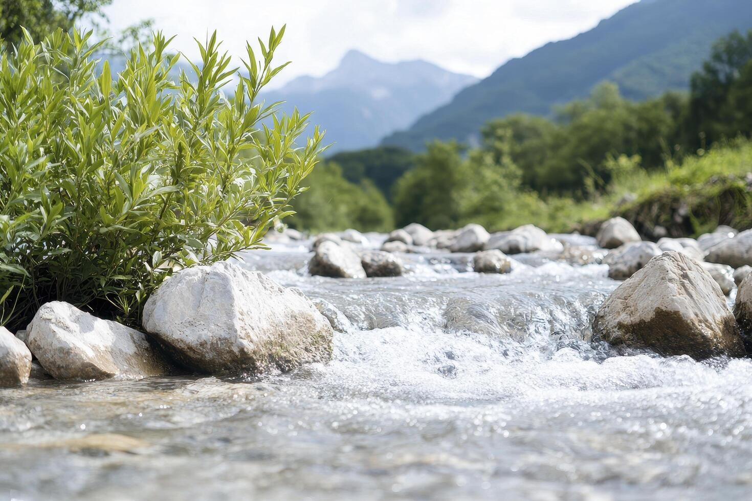 A serene landscape unfolds, where a gentle river gracefully cascades over smooth, sun-kissed pebbles, creating a soothing symphony of nature's music The crystal-clear water reflects the surrounding photo