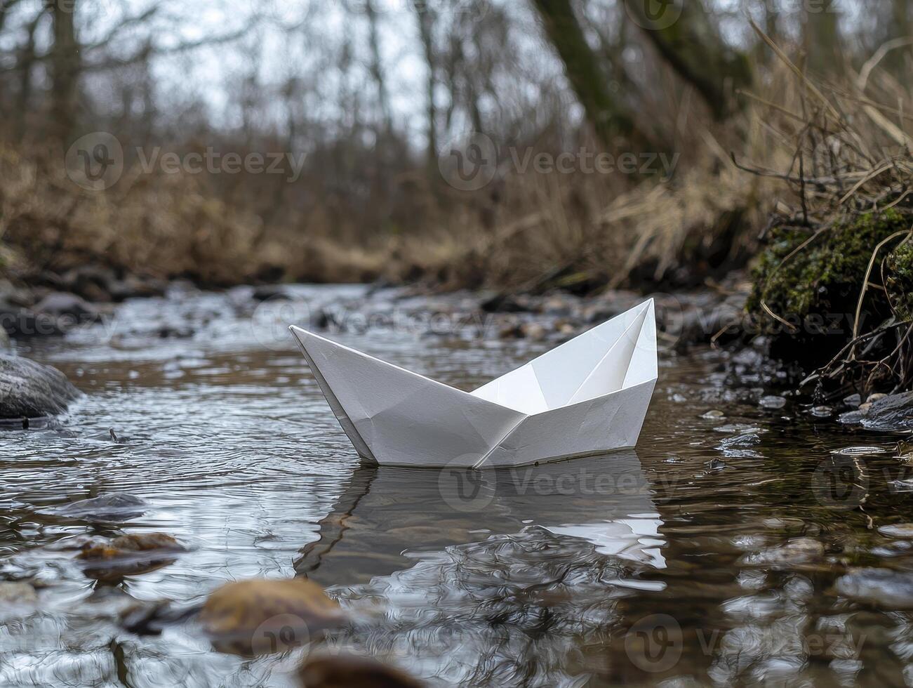A simple paper boat, carefully folded and launched with a child's dreams, now journeys along a winding stream, carried by the gentle current and soft breeze Each ripple and eddy whispers tales of photo