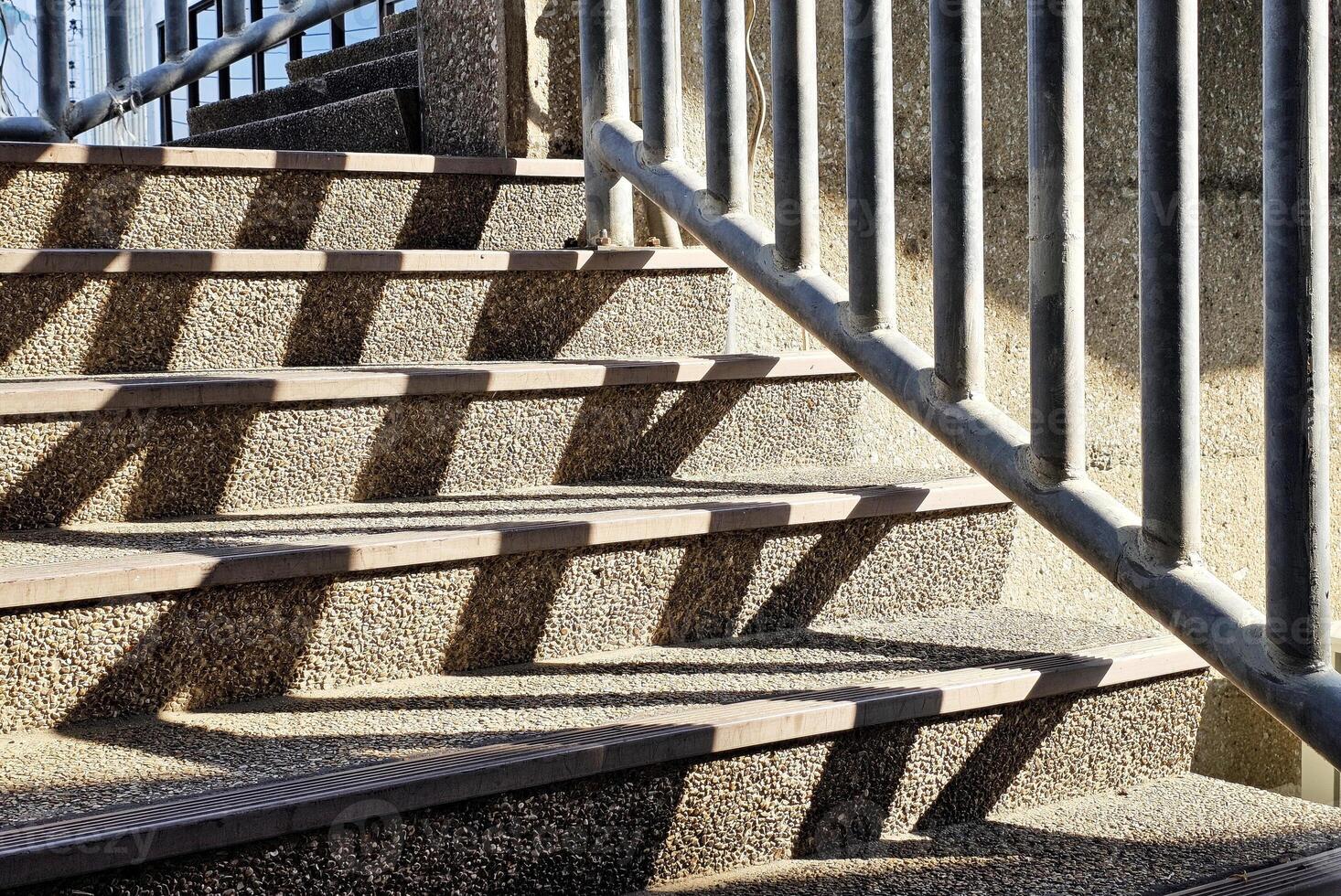 Concrete Stair of Overpass with Light Beam and Fence Shadow. photo