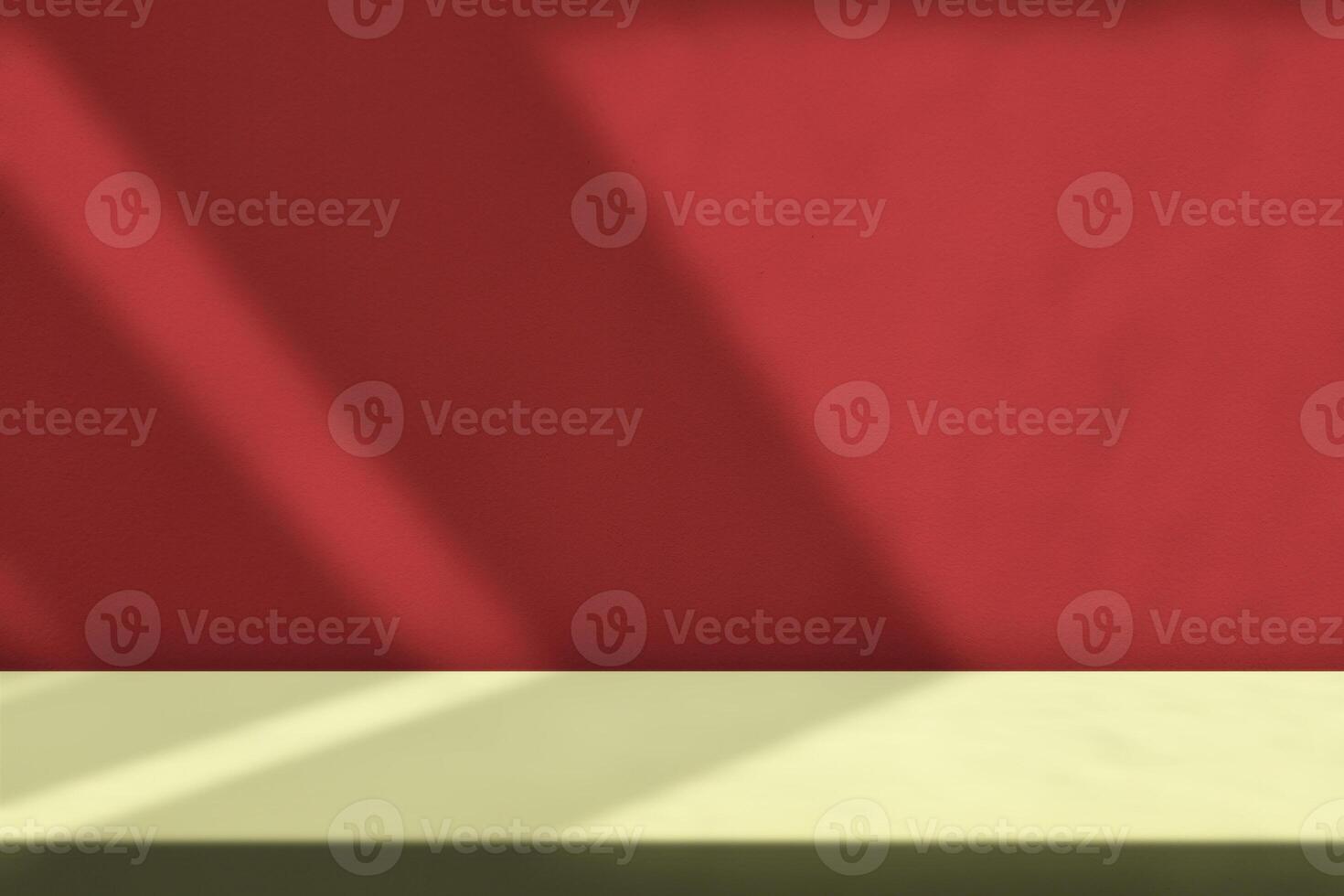 Table with Light Beam and Shadow on Red Wall Background photo