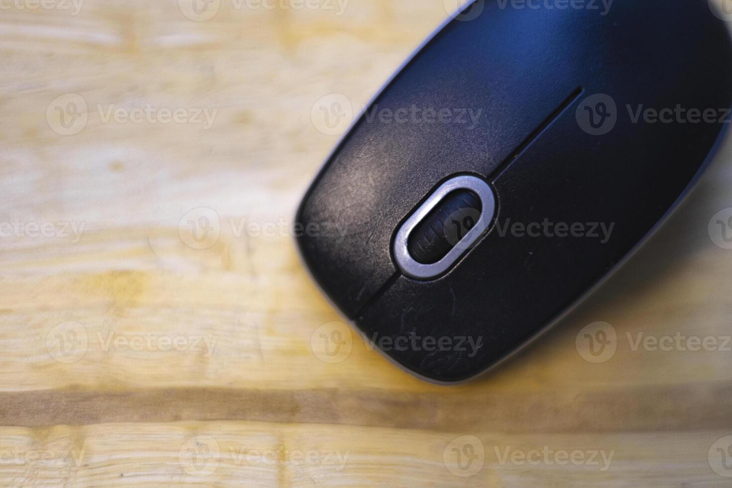 Top View Of Mouse Is Placed On The Wooden Table photo