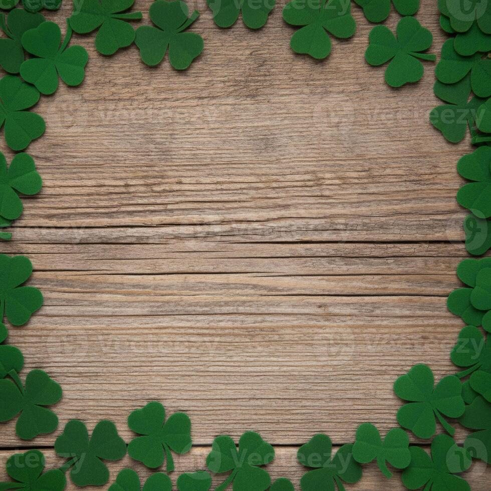 Green shamrocks forming a decorative frame on light wooden background festive Irish themed border for St Patricks Day celebrations photo