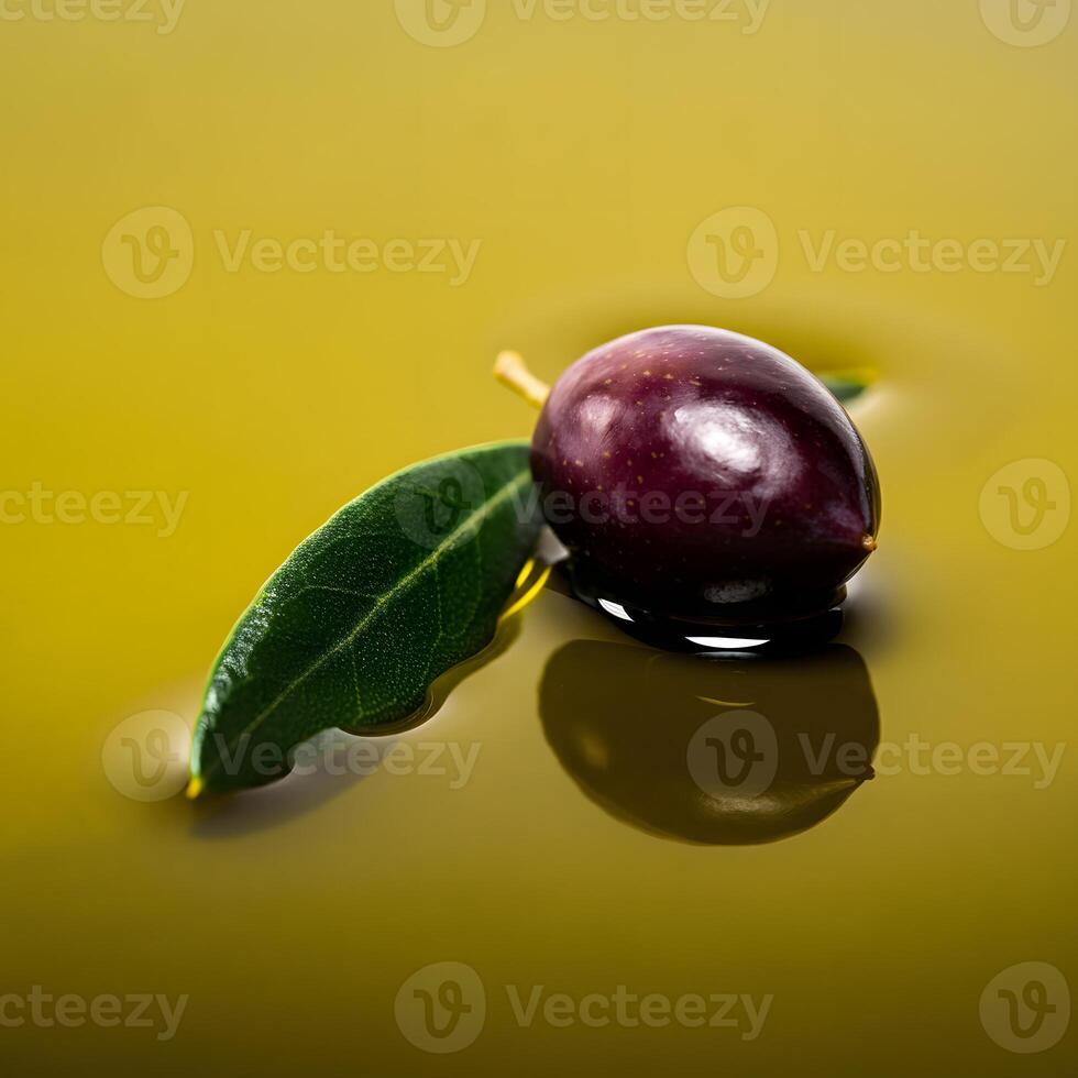 Close up of a ripe olive with green leaves resting on the surface of golden olive oil gourmet Mediterranean cuisine healthy food photo