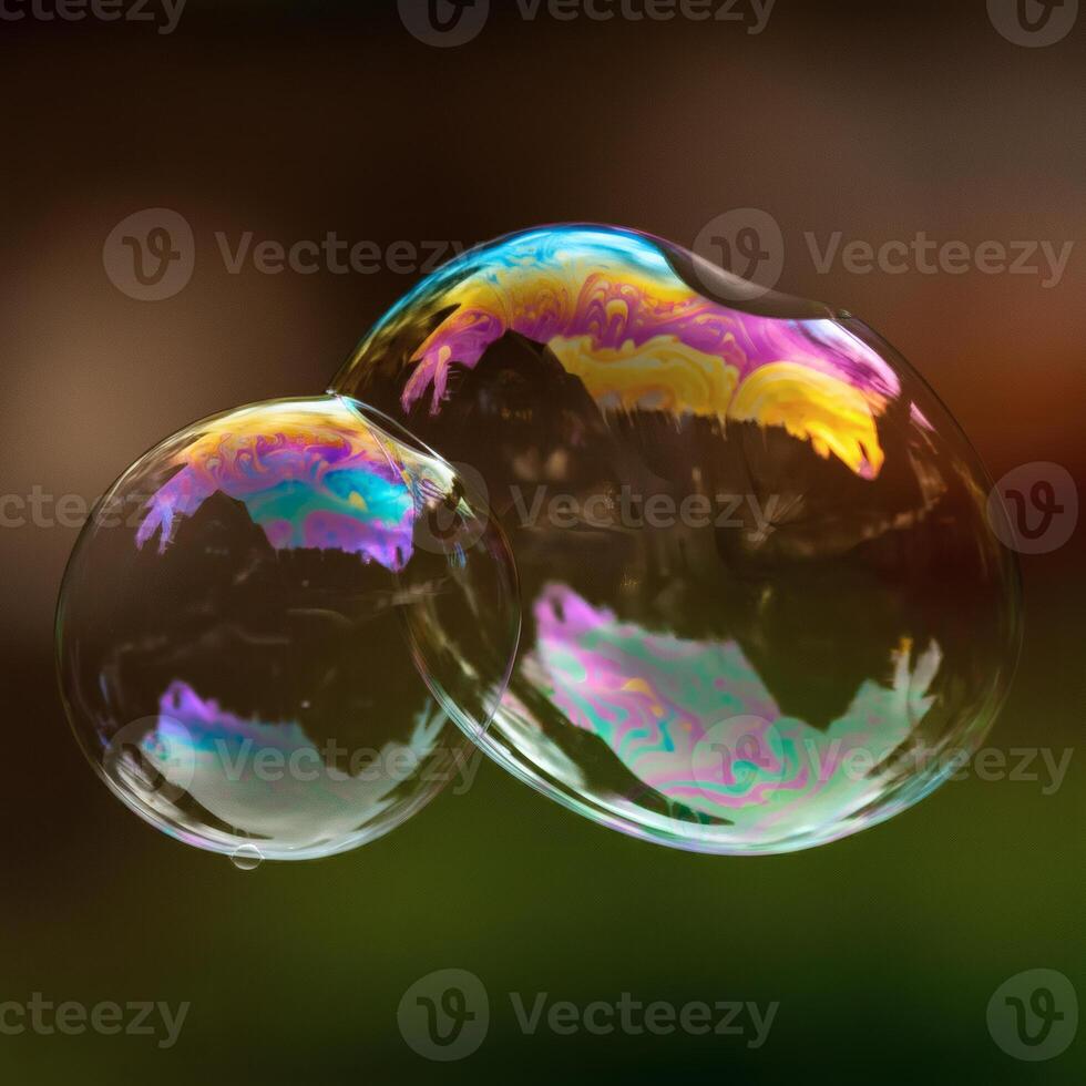 Floating soap bubble reflecting rainbow colors with water surface in night background surreal magical abstract concept photo