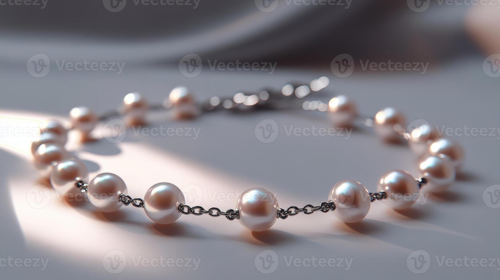 Elegant pearl bracelet with silver chain in soft sunlight photo