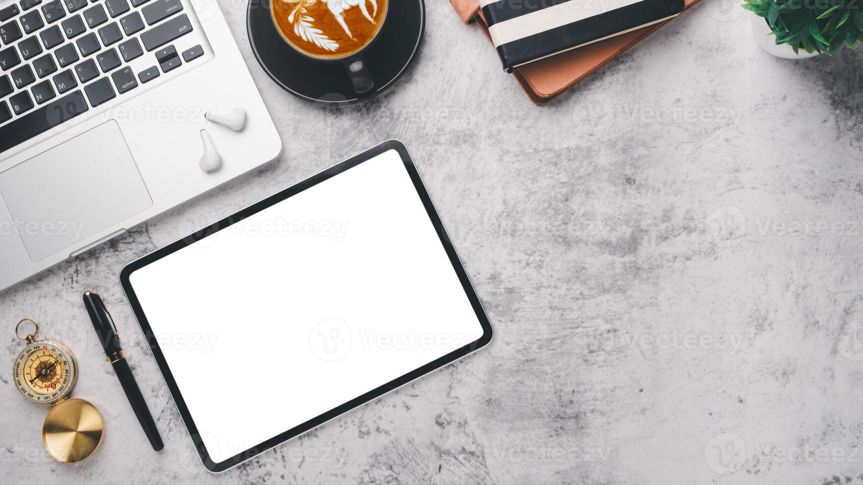 Modern office desk workplace with blank screen digital tablet, pen, laptop computer, notebook and cup of coffee, Top view flat lay with copy space. photo