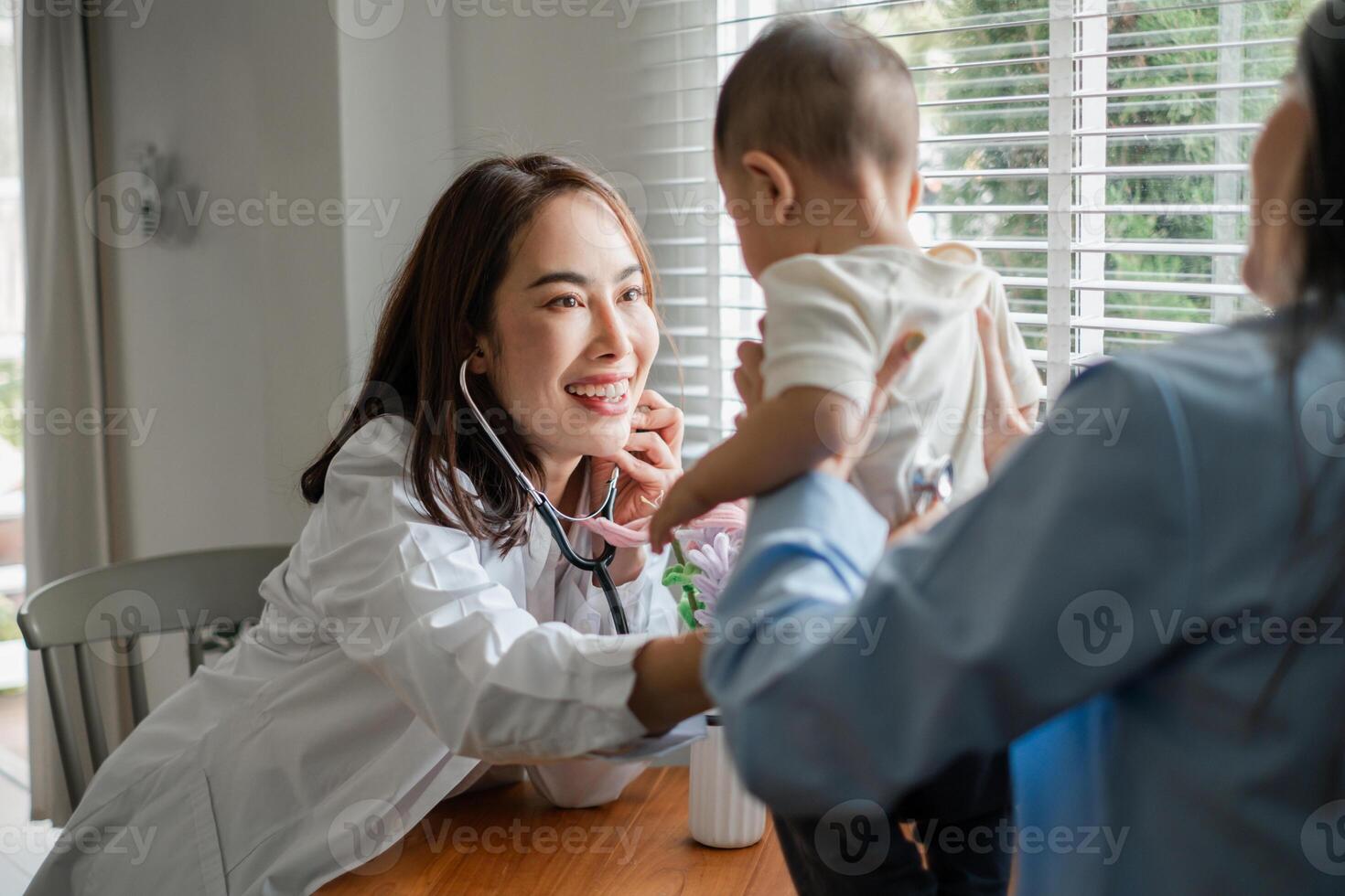 Pediatrician interacting with a baby during a checkup, showcasing a caring medical environment. photo