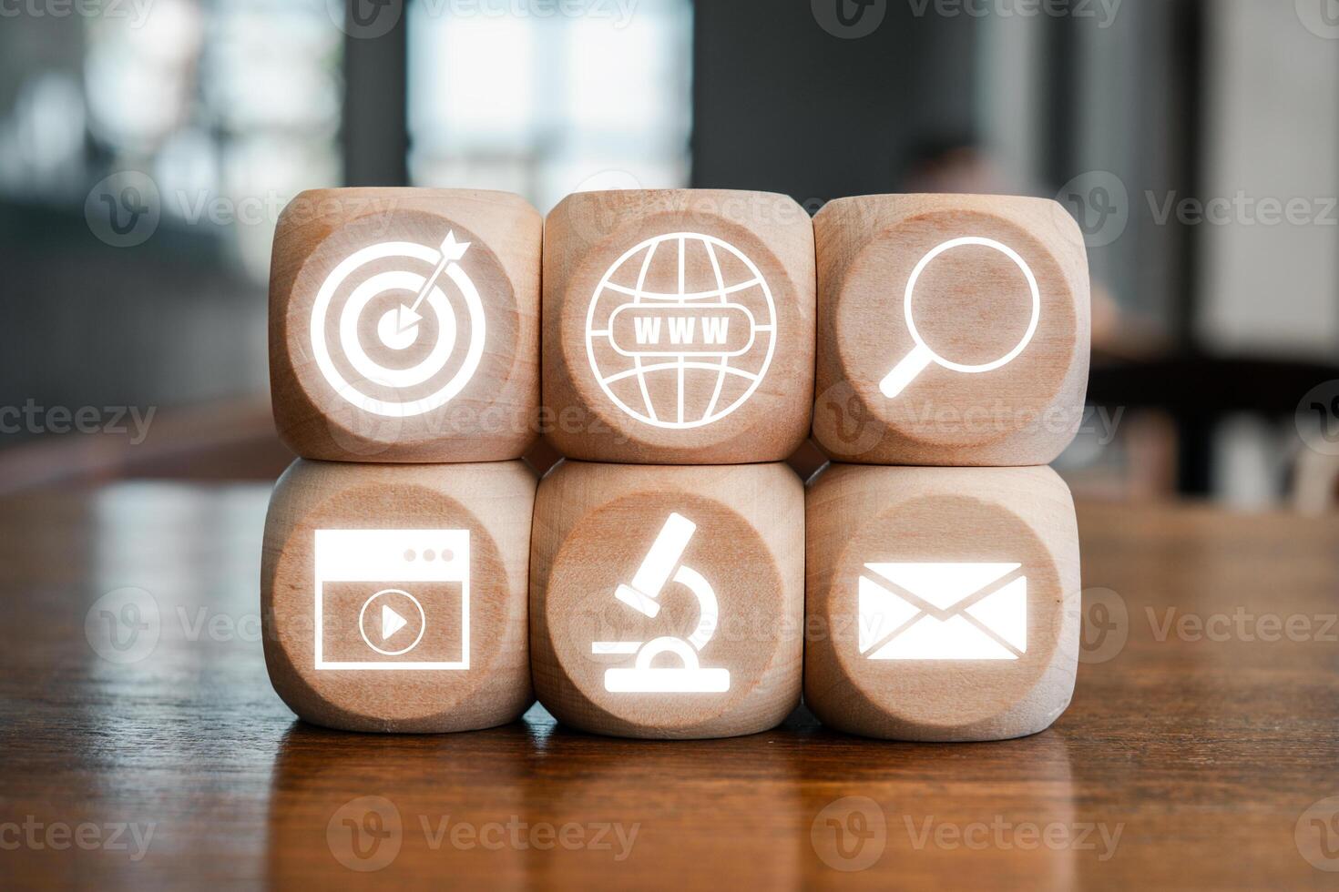 Wooden blocks with digital marketing icons symbolize innovative content marketing strategies for online business growth. photo