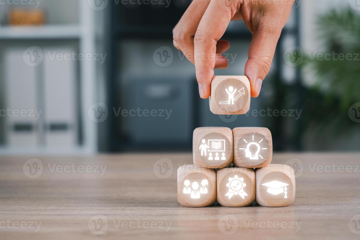 Wooden cubes with business icons symbolize the strategic elements of a Master of Business Administration. photo