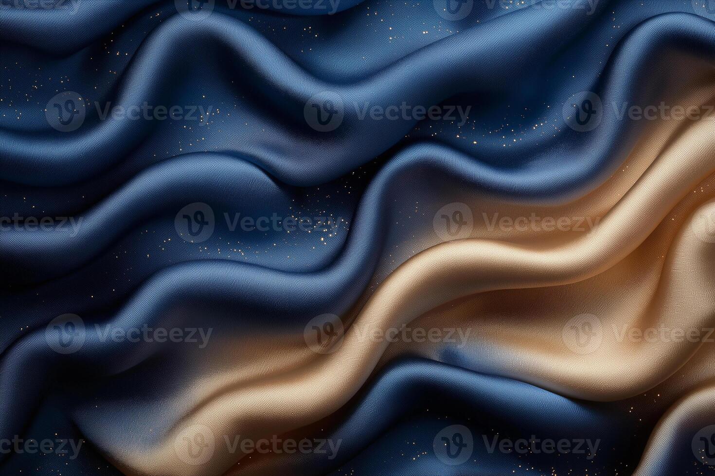 Elegant waves of fabric shimmering in shades of blue and gold create a mesmerizing visual experience. photo