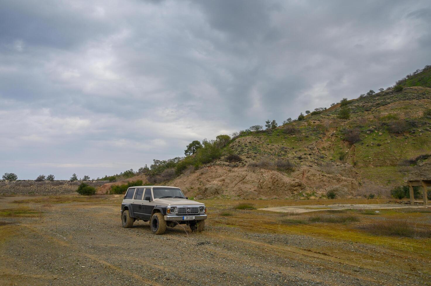 Gaziveren Cyprus -15.02.2025 Off-road adventure in rugged terrain under an overcast sky in a remote area photo
