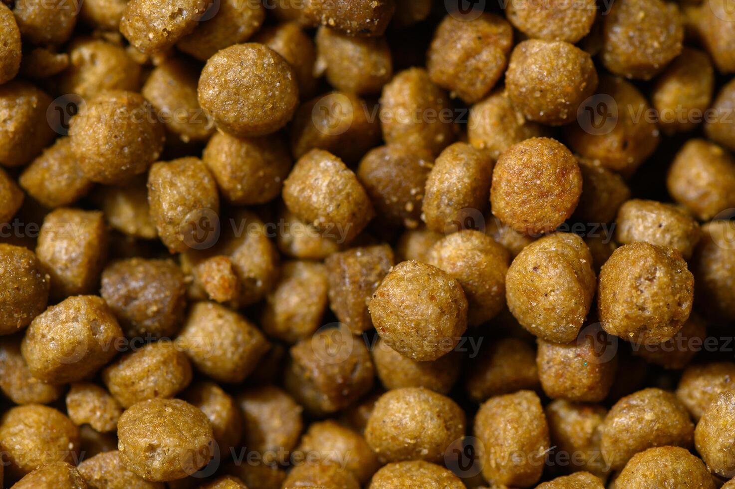 Crunchy pet food pellets scattered on a surface create a vibrant feeding display photo