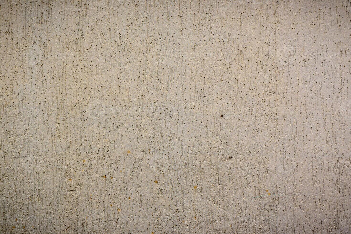 Textured wall with subtle hues showcasing the beauty of simplicity and raw materials in urban environments photo