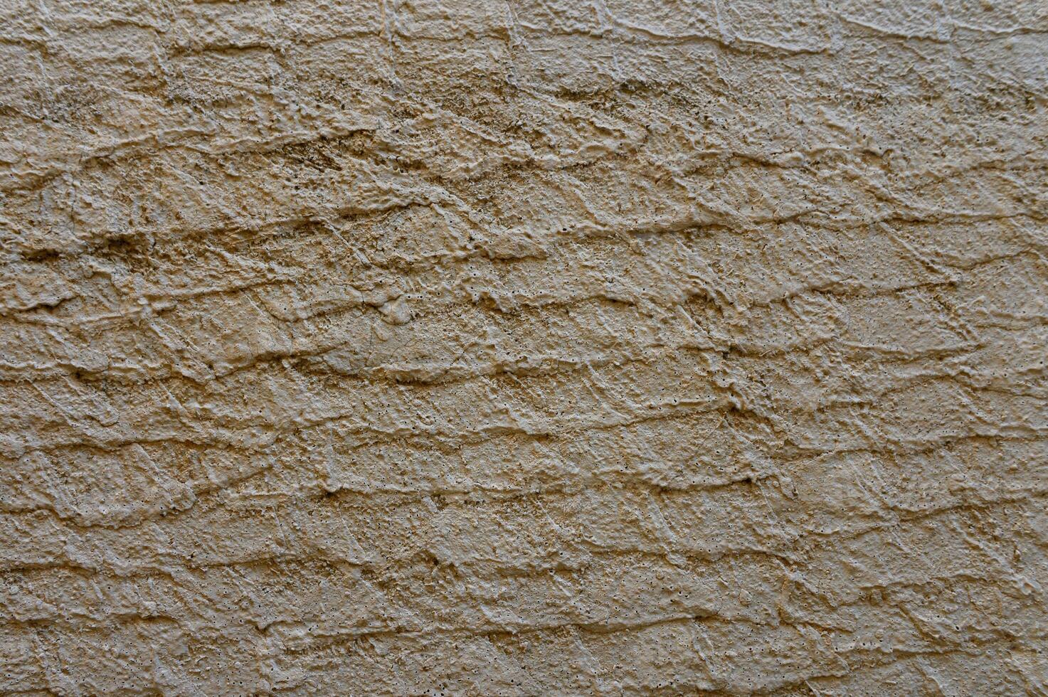 Textured wall brings rustic charm to urban environment during sunny afternoon photo