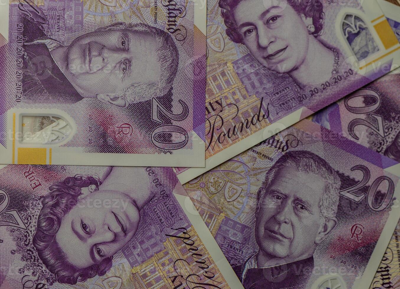 Explore the intricacies of British currency featuring portraits of royalty and vibrant designs in close-up view photo