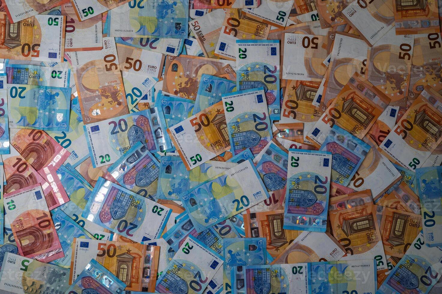 Colorful array of euro banknotes spread out on a flat surface in a vibrant display photo
